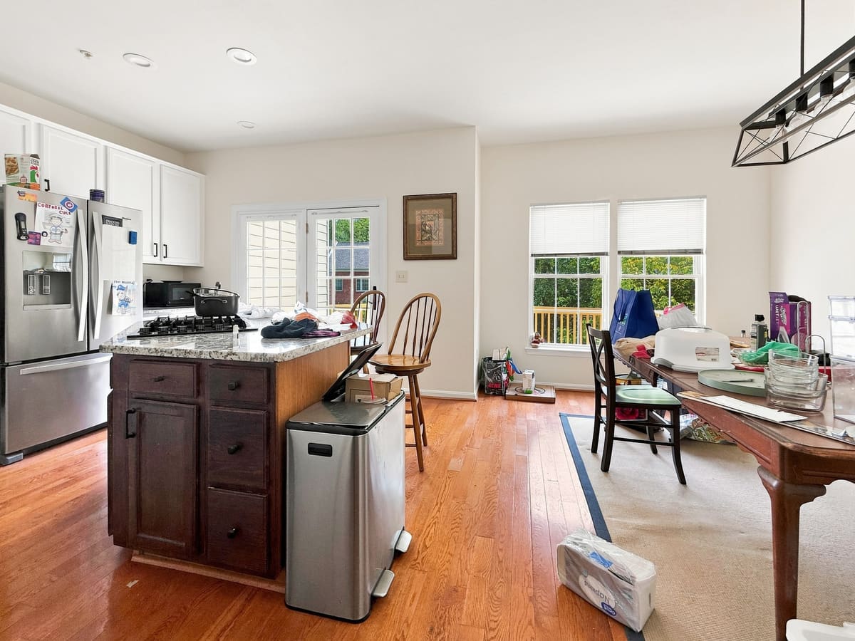 Kitchen with island and hardwood floors, finished with Cove Capture
